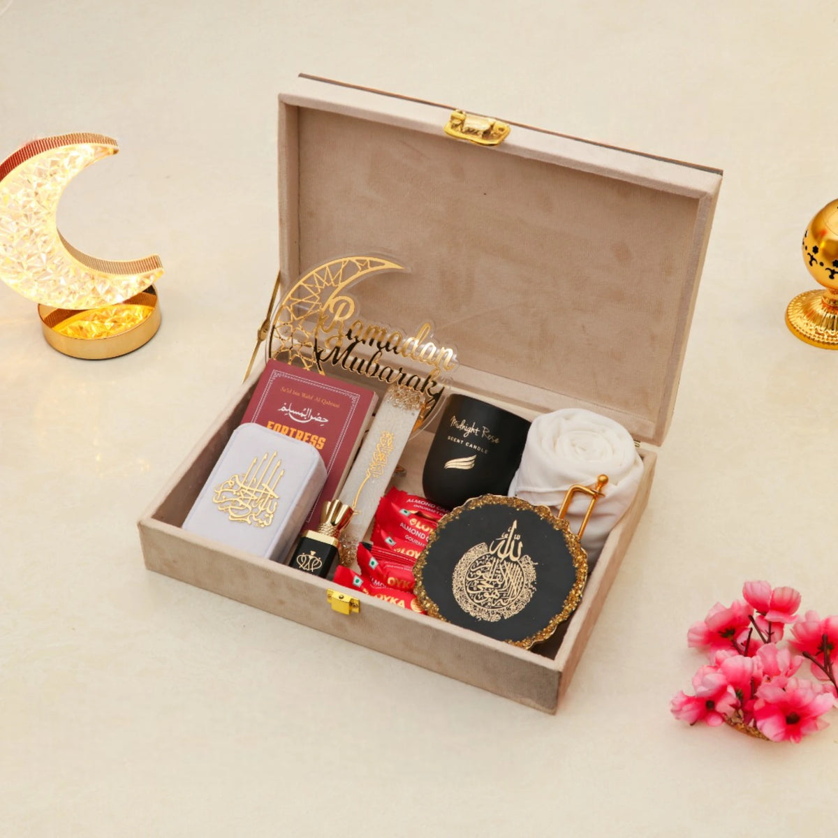 Noor Al-Ramadan Gift Box open with prayer items, hijab, Islamic decor, and candle, perfect for Ramadan gift delivery.