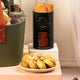 Saint Moritz Biscotti cashew almond crunch cookies in a black container on a table.