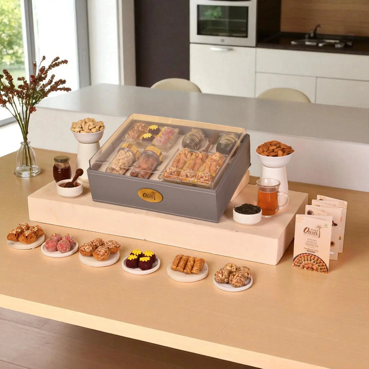 The Regal Treat Box - Elegant Festive Sweets Hamper featuring assorted baklawa, fusion balls, dry fruits, and tea, ideal for gifting occasions.