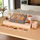 The Regal Treat Box - Elegant Festive Sweets Hamper featuring assorted baklawa, fusion balls, dry fruits, and tea, ideal for gifting occasions.