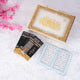 Quran box with intricate gold and pink design on white surface