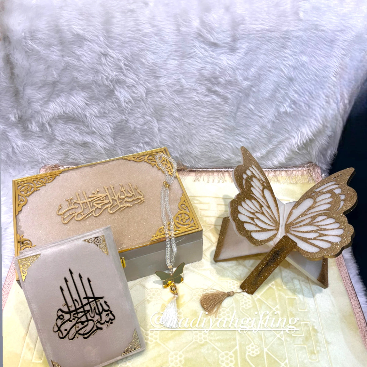 Butterfly Sawab-e-Jariya gift set in offwhite with velvet Quran, golden butterfly Rehal, Tasbeeh, and Janamaz. Ideal for Islamic gifting.