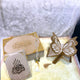 Butterfly Sawab-e-Jariya gift set in offwhite with velvet Quran, golden butterfly Rehal, Tasbeeh, and Janamaz. Ideal for Islamic gifting.