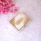 Closed designer box from the Velvet Quran Gift Set - Offwhite Flakes with golden Arabic calligraphy and flake embellishments. Premium religious gift item.