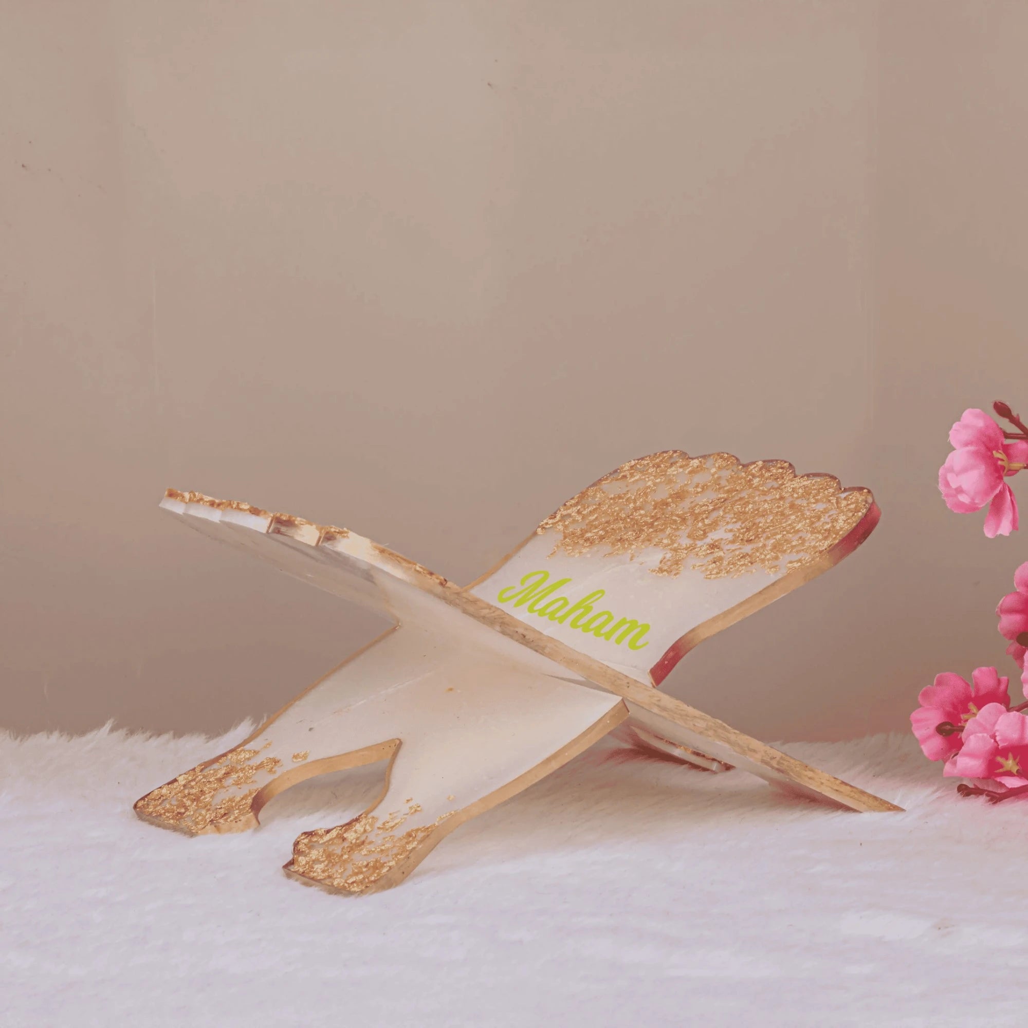 Offwhite resin Quran stand with gold flakes and personalized name 'Maham', foldable design ideal for gifting and religious use. Main image