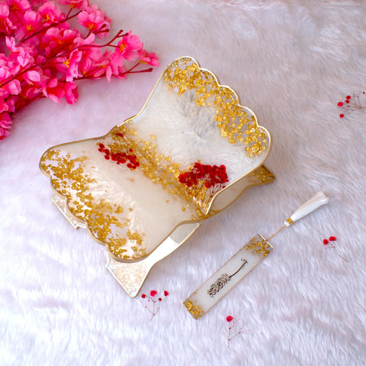 Handcrafted resin Rehal with gold and red floral accents from the Floral Pearl Rehal Hamper. Elegant support for Quran recitation.