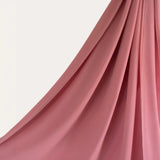 Close-up of Coral Delight Premium Chiffon Hijab showcasing its flowy, sheer texture and graceful fall for versatile hijab styling.