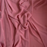 Flat lay of Coral Delight Premium Chiffon Hijab showing its soft, breathable fabric and smooth drape, perfect for layering.