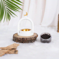 Premium Pearl Crescent Burner for bakhoor, featuring a crescent moon design, displayed with incense and wood chips for home fragrance rituals.