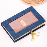 Brown leather diary with gold label in a blue floral gift box