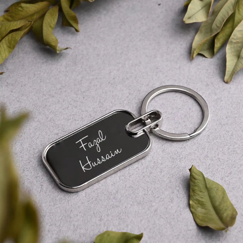 Close-up of personalized engraved keychain with leafy decor Main image