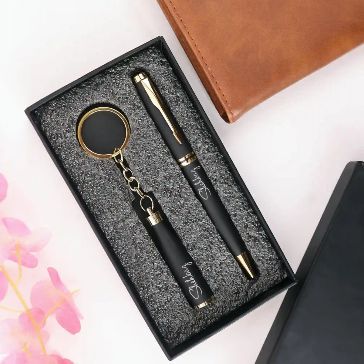 Gift set of engraved black pen and keychain in foam-lined box
