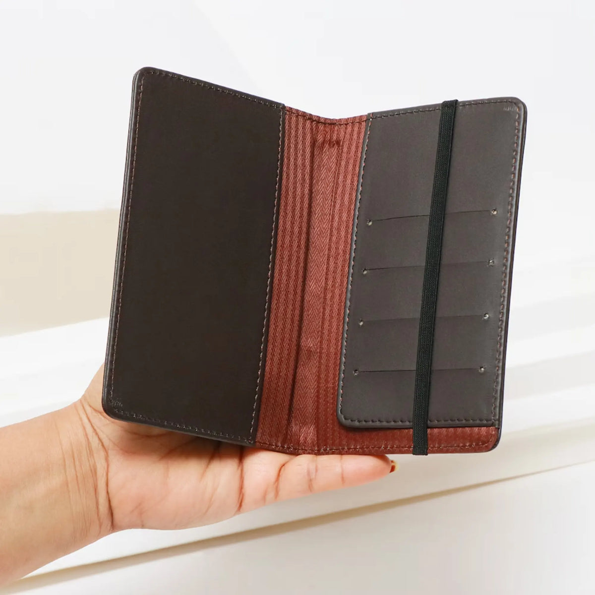 Brown leather passport cover with elastic band