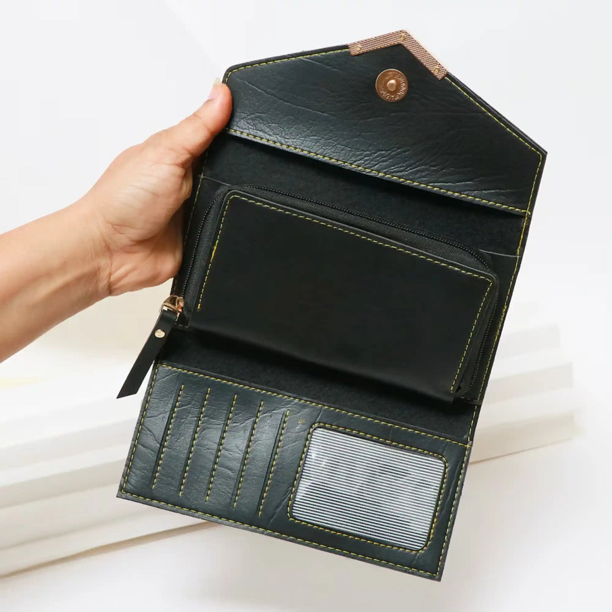 Black leather wallet with zip pocket and card slots