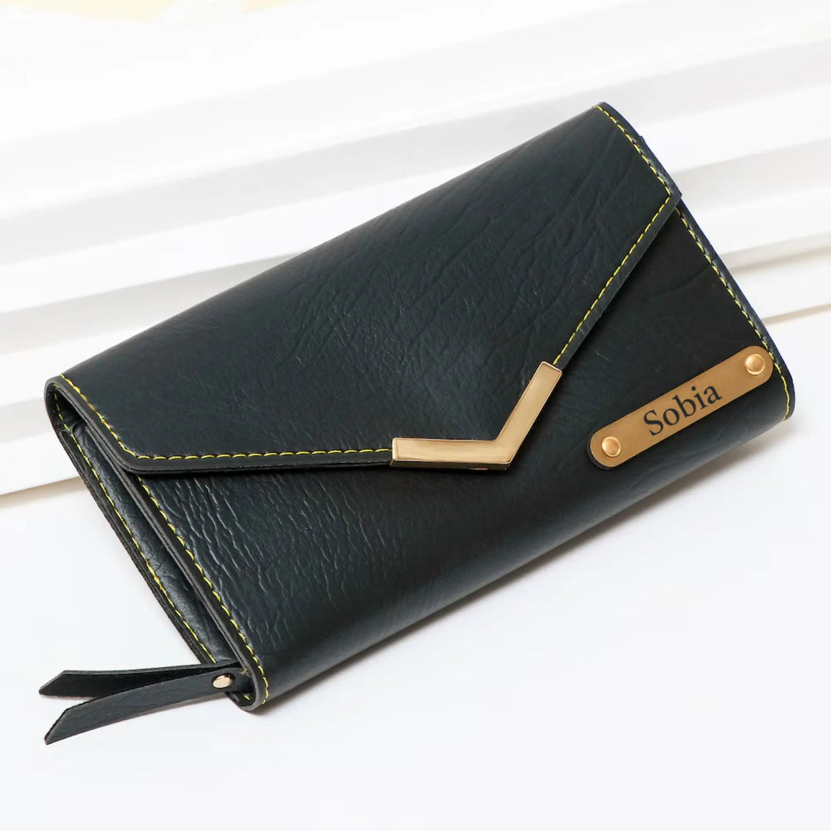 Black leather wallet with zipper pocket and card slots