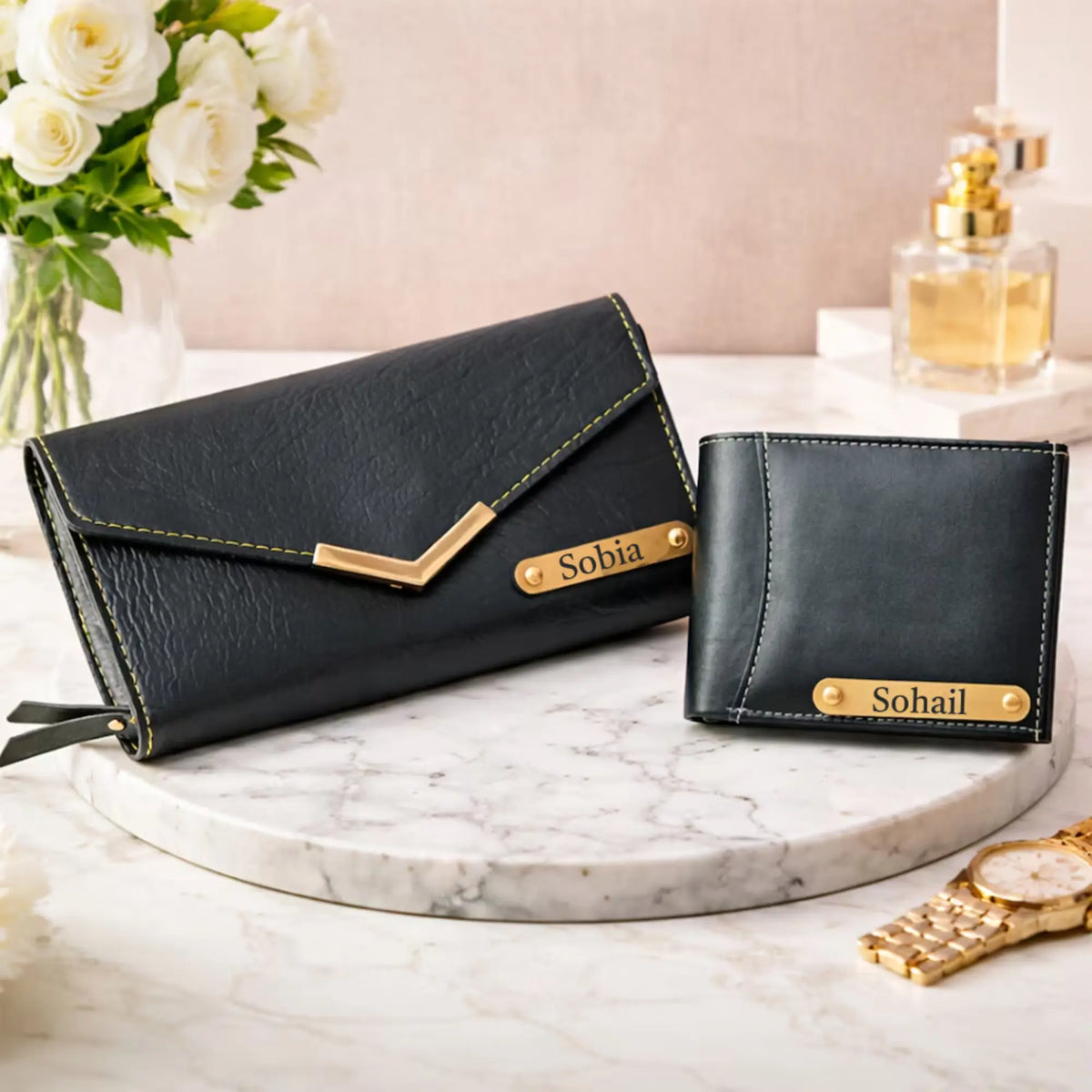 Black leather wallet with yellow stitching and gold accents