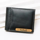 Close-up of black leather wallet with white stitching and card slot