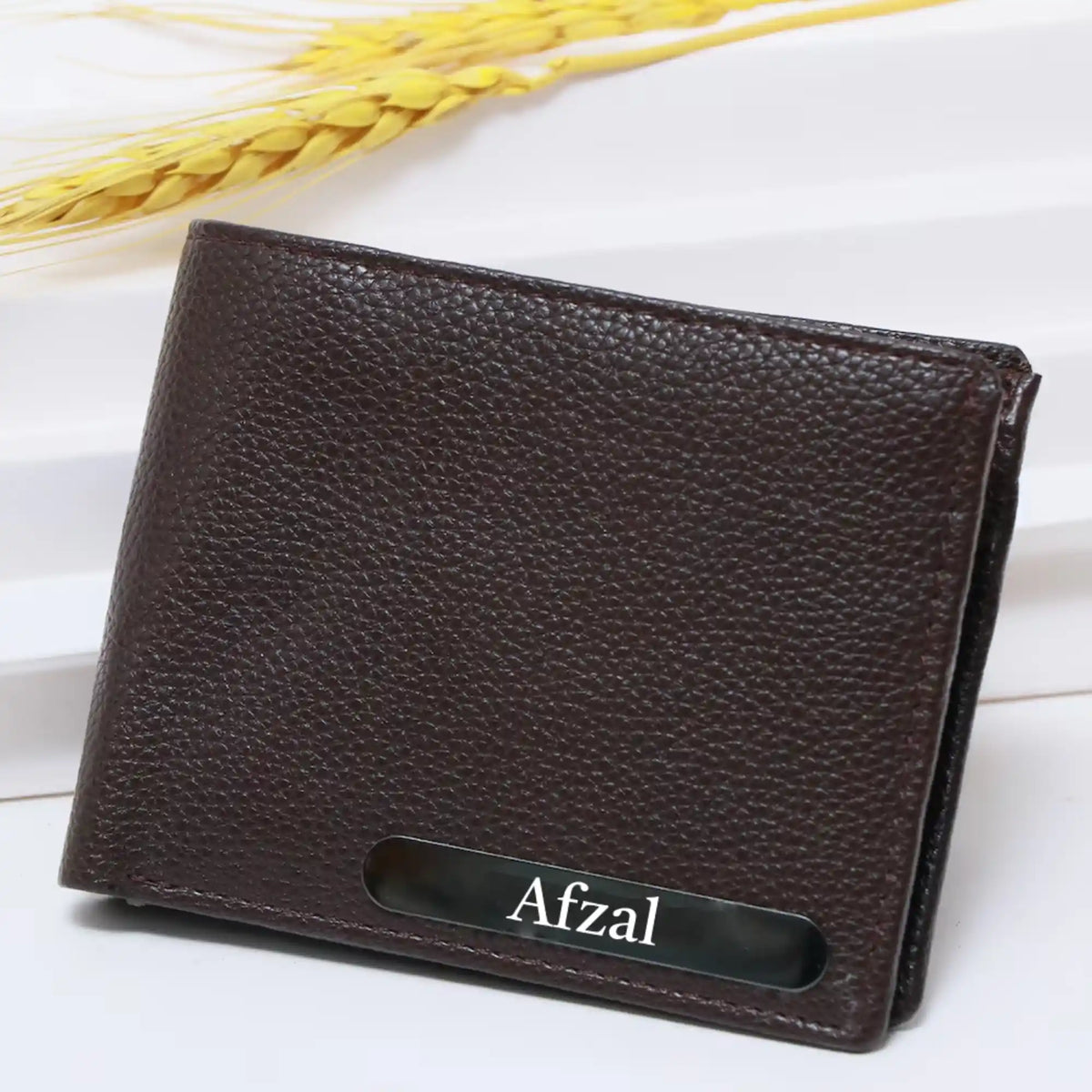Close-up of brown leather wallet with textured surface