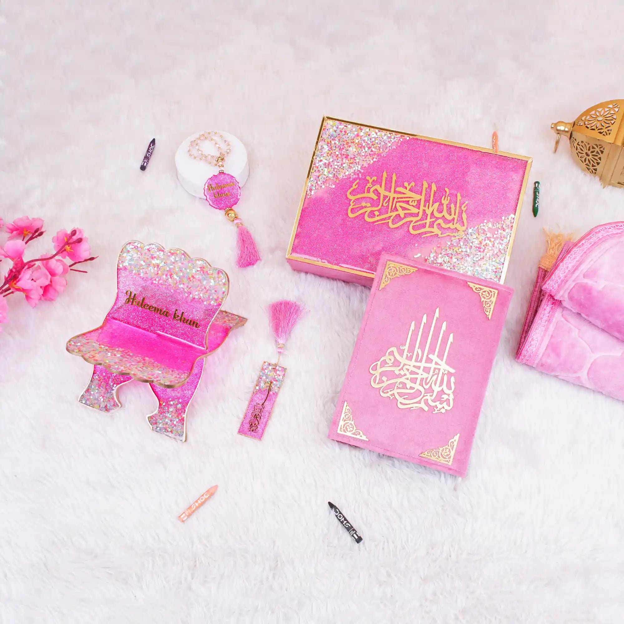 Buy Pink Kids Glitter Collection Ibadah Gift Set for Kids Online featuring a glittery Quran, tasbih, prayer rug, and accessories in a pink theme. Main image