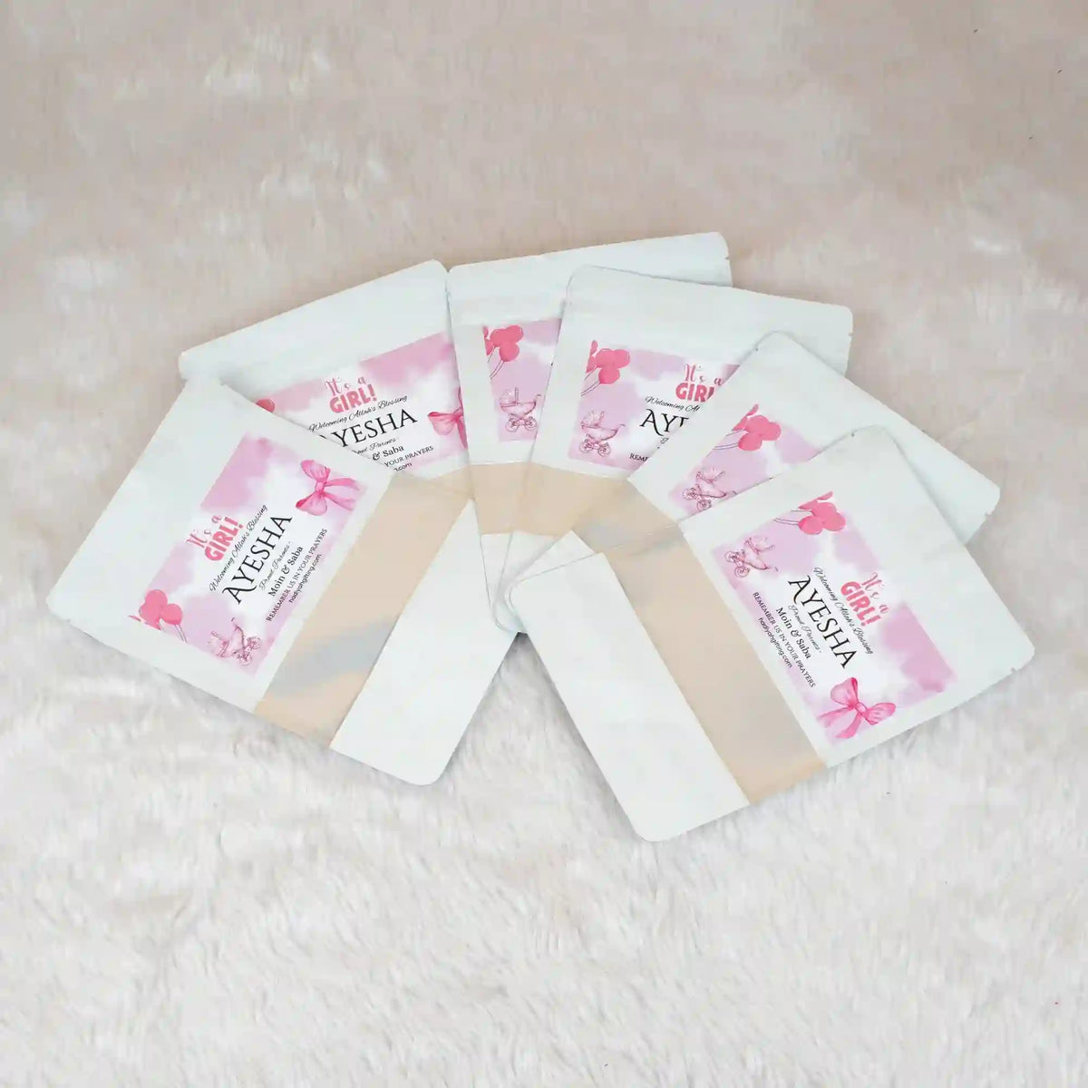 Aqiqah Meat Packets - meat packet | 12 units, customisation displayed in a fan layout with personalized labels for a baby girl named Ayesha.