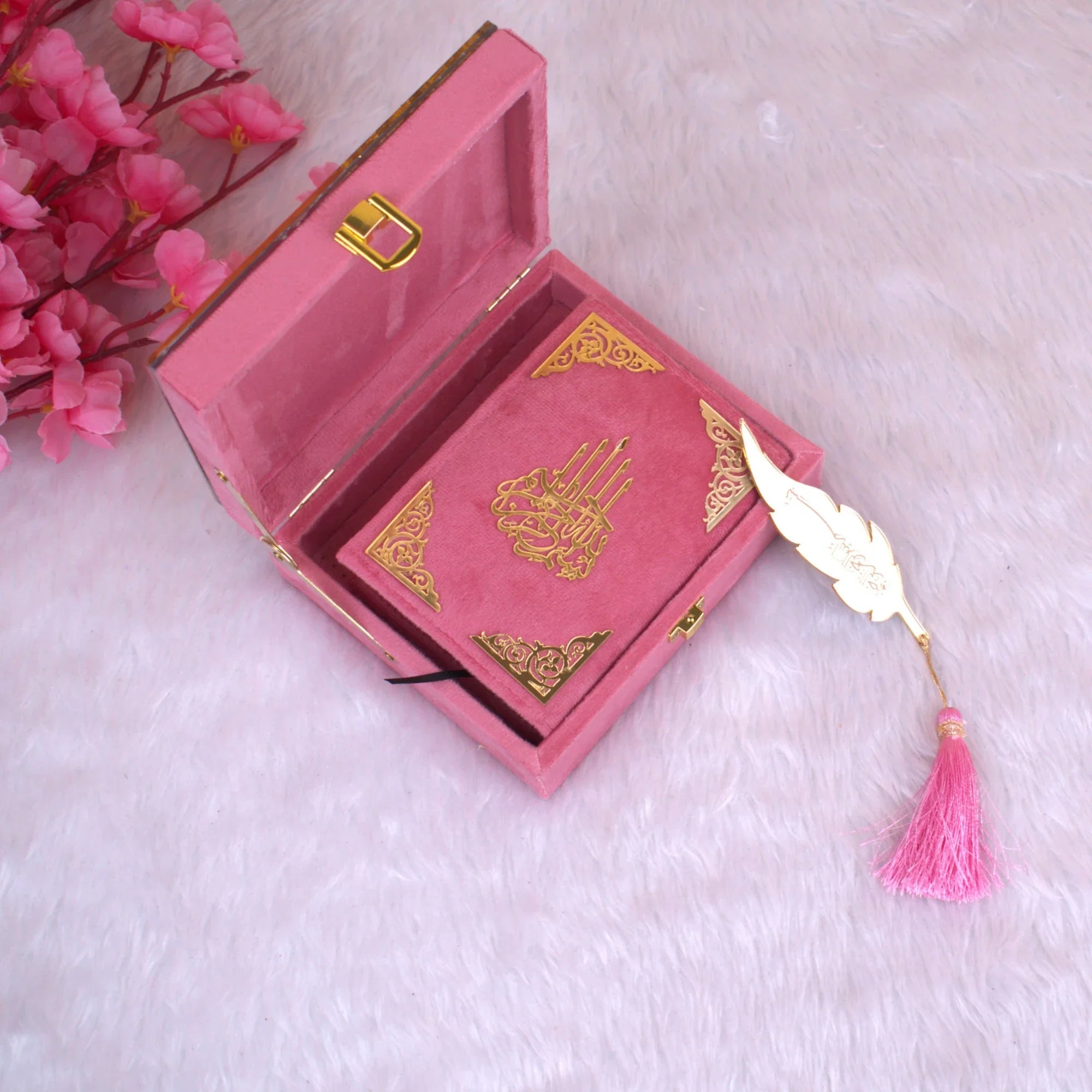 Velvet Mini Quran Set - Pink Flakes Collection featuring a pink velvet Tilawat-e-Quran with gold detailing and feather bookmark in a gift box. Main image