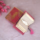 Open Pink Flakes Mini Tilawat-e-Quran with feather tassel bookmark, displayed in a velvet box from the Velvet Mini Quran Set gift collection.