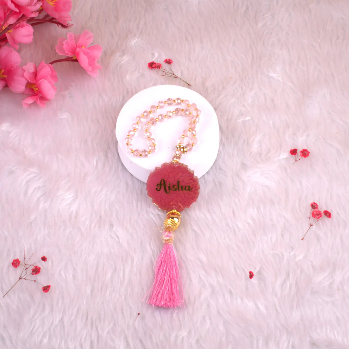 Pink Tasbeeh Beads with Resin Agate and name 'Aisha', 33 glitter beads perfect for kids' Islamic gifts and ceremonial occasions.