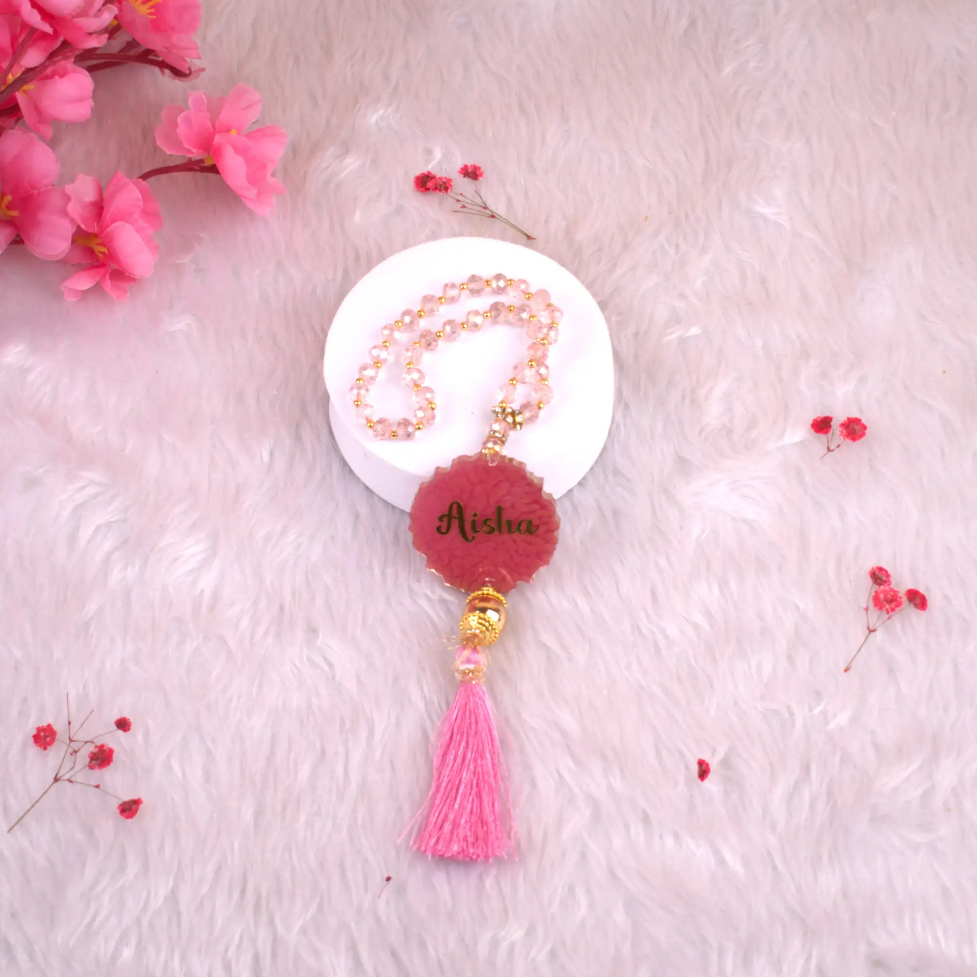 Pink Tasbeeh Beads with Resin Agate and name 'Aisha', 33 glitter beads perfect for kids' Islamic gifts and ceremonial occasions.