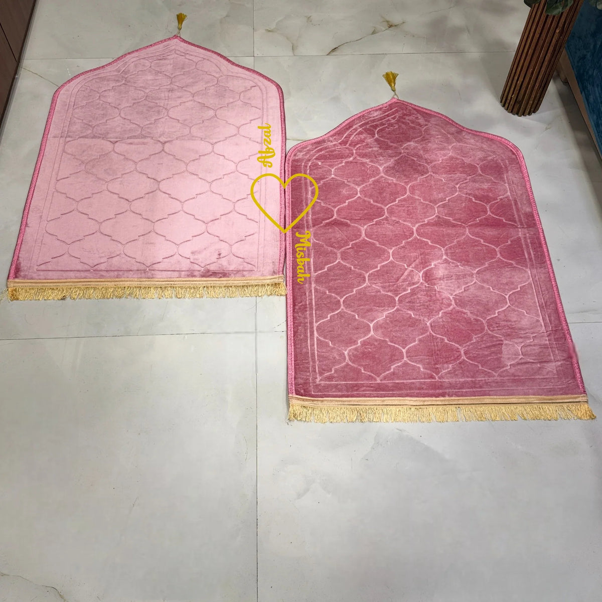 Velvet-textured pink prayer mats with gold fringe, included in the Sawab-e-Jariya bridal hamper. Elegant Islamic wedding gift set.