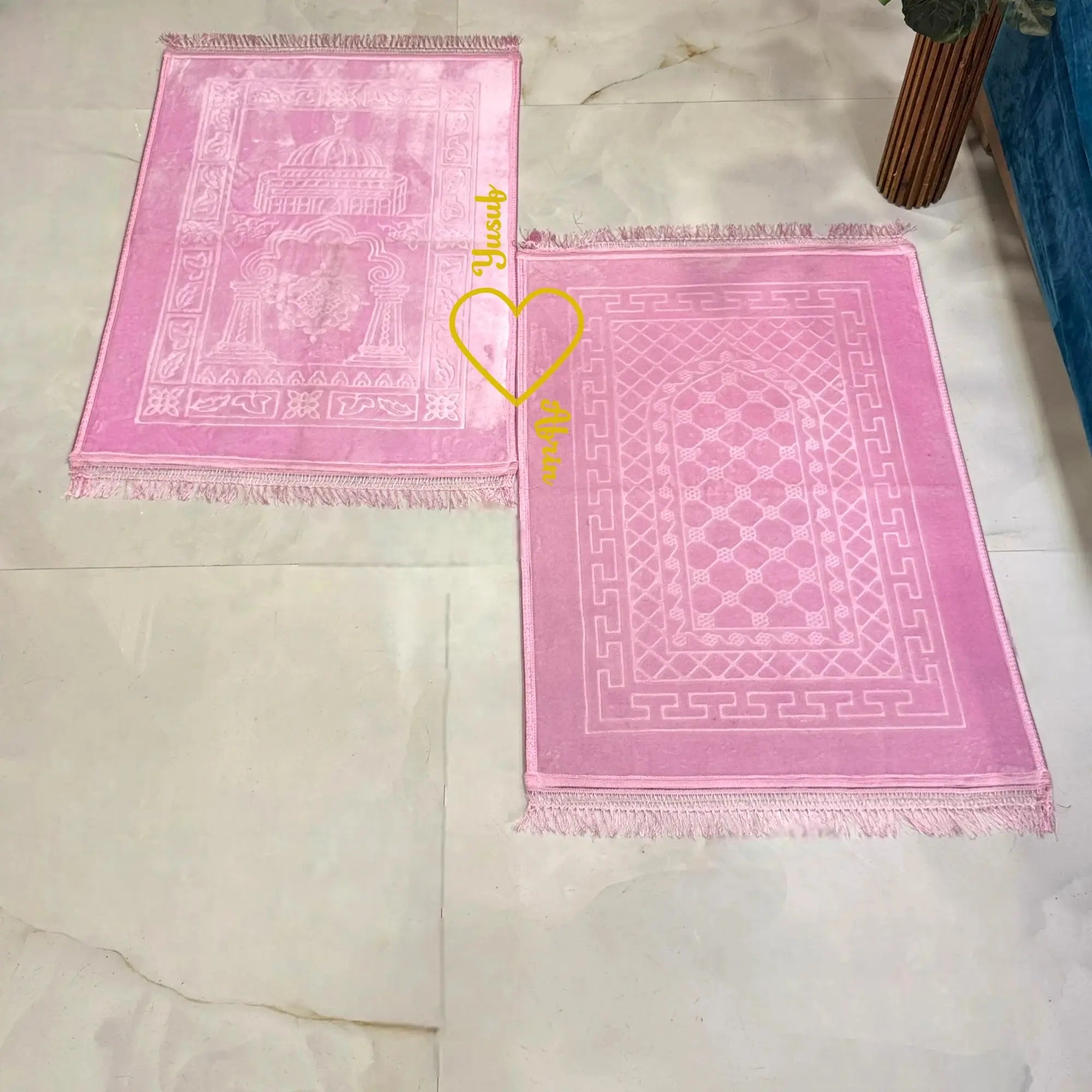 Set of two pink prayer mats with Islamic patterns, part of the Sawab-e-Jariya bridal gift hamper. Ideal for couple prayer gifting. Main image