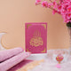 Custom Pink Salah Hamper displayed with Quran on stand, pink Janamaz, and personalized Tasbeeh. Enhance prayer experience with style.
