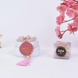 Pink Crystal Tasbeeh Name - Personalized Crystal 100 Beads displayed with floral decor and gift box, ideal for gifting and spiritual use.