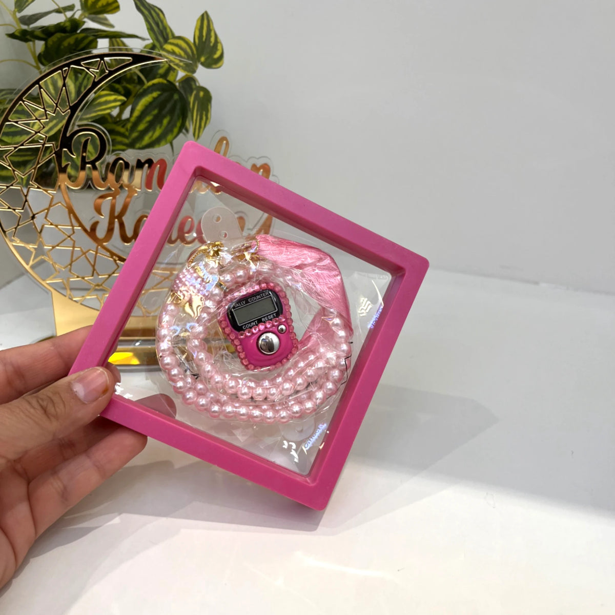 Pink Transparent Tasbeeh Combo - Islamic Gift Set featuring 100-bead pearl tasbeeh and digital counter in a pink display frame, ideal for dhikr.