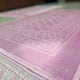 Close-up of elegant pink rectangle Couple Janamaz with intricate geometric design, showcasing soft texture and premium finish for prayer use.