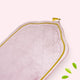 Pink quilt with green leaves on a white background