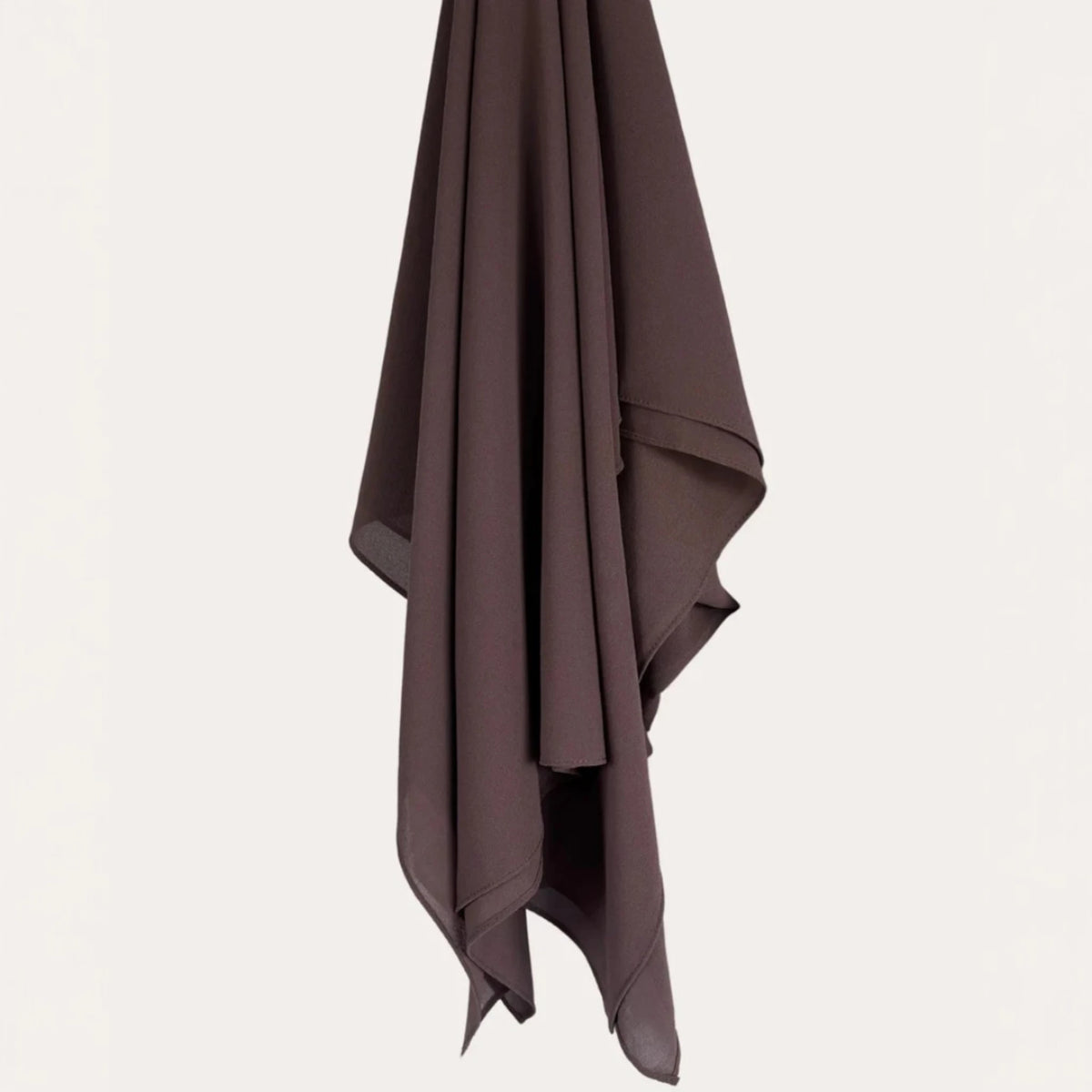 Cocoa Chic Chiffon Hijab hanging flat to display its smooth finish and premium quality suitable for everyday modest wear.