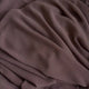 Close-up of brown fabric with folds