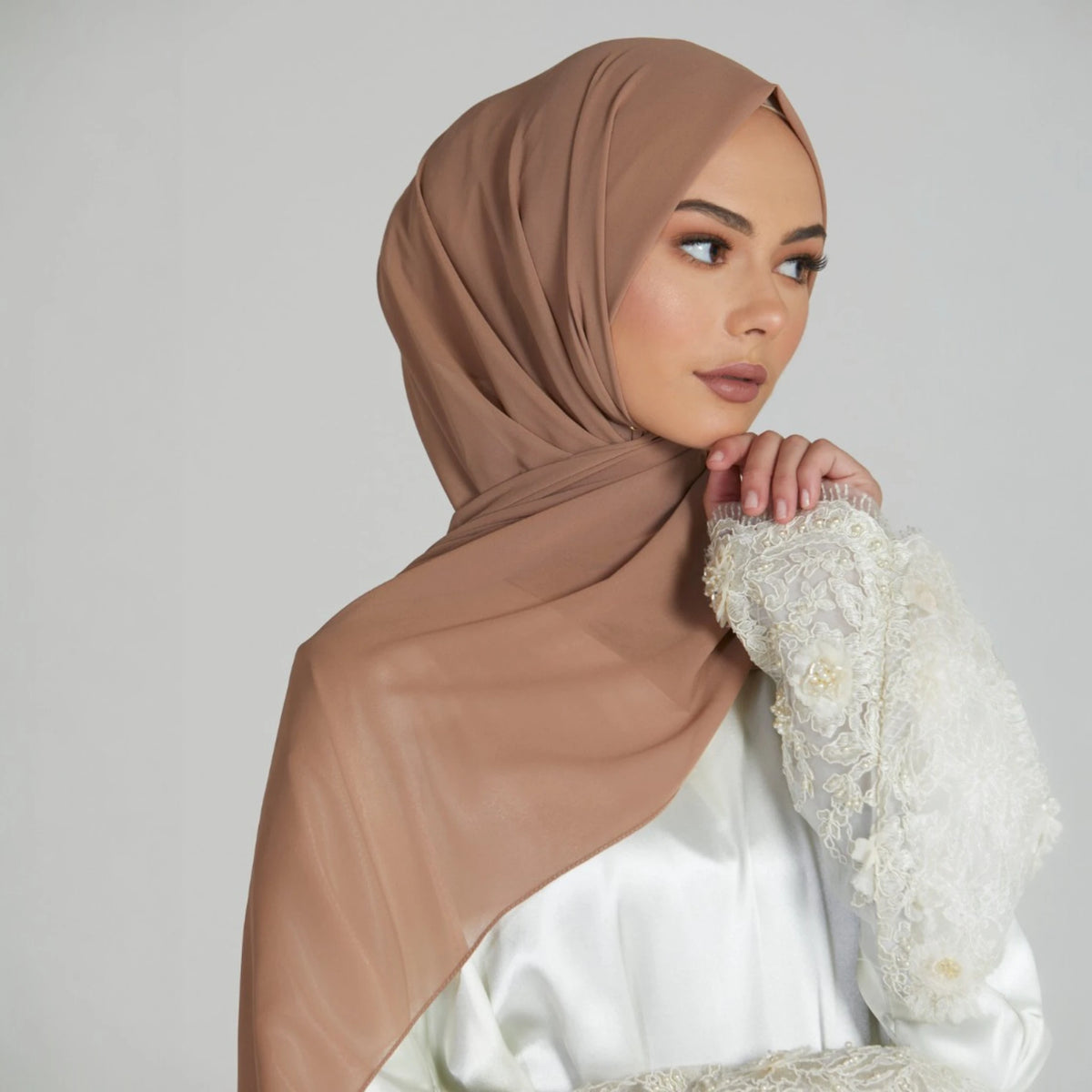 Elegant Biscotti Beige Chiffon Hijab styled with lace sleeve outfit. Smooth, breathable fabric perfect for formal or casual wear.