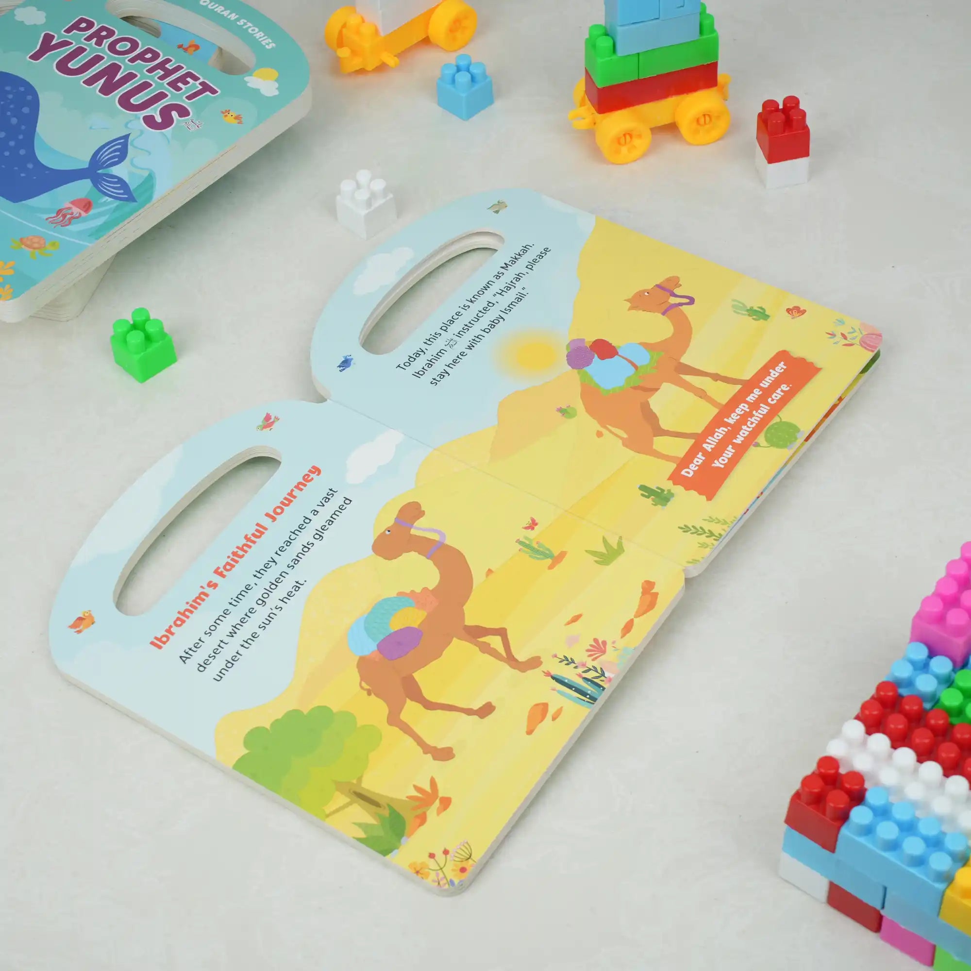 Children's book with colorful illustrations on a white surface with toys around