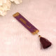 Purple Flakes Quran bookmark with golden Arabic calligraphy and maroon tassel. Elegant accessory in Rehal Hamper Gift Set for women.