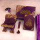 Purple and gold religious items including a book and chair on a light background