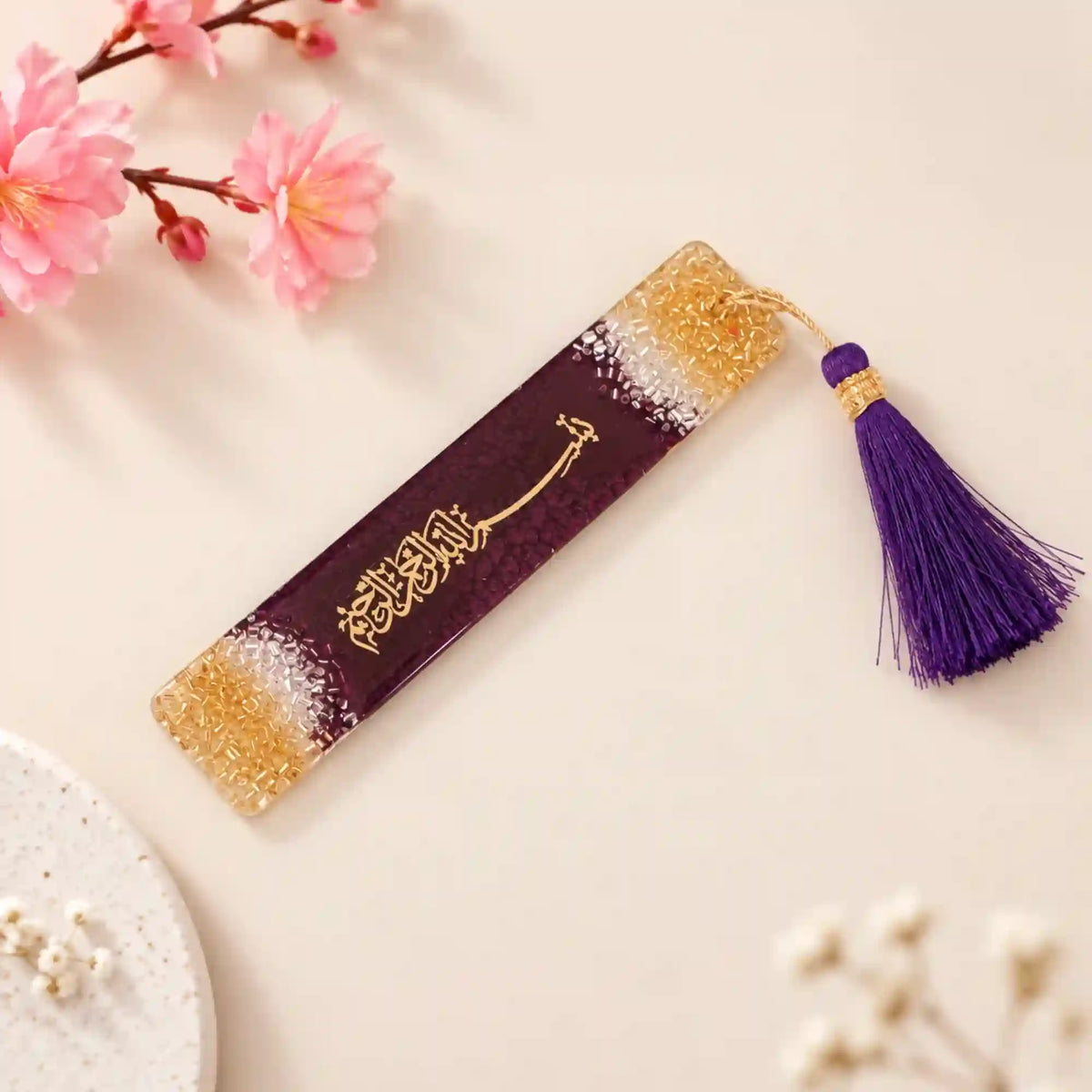Custom Islamic bookmark in pink and gold resin with Arabic calligraphy and matching tassel, perfect for wedding favors or spiritual gifts.