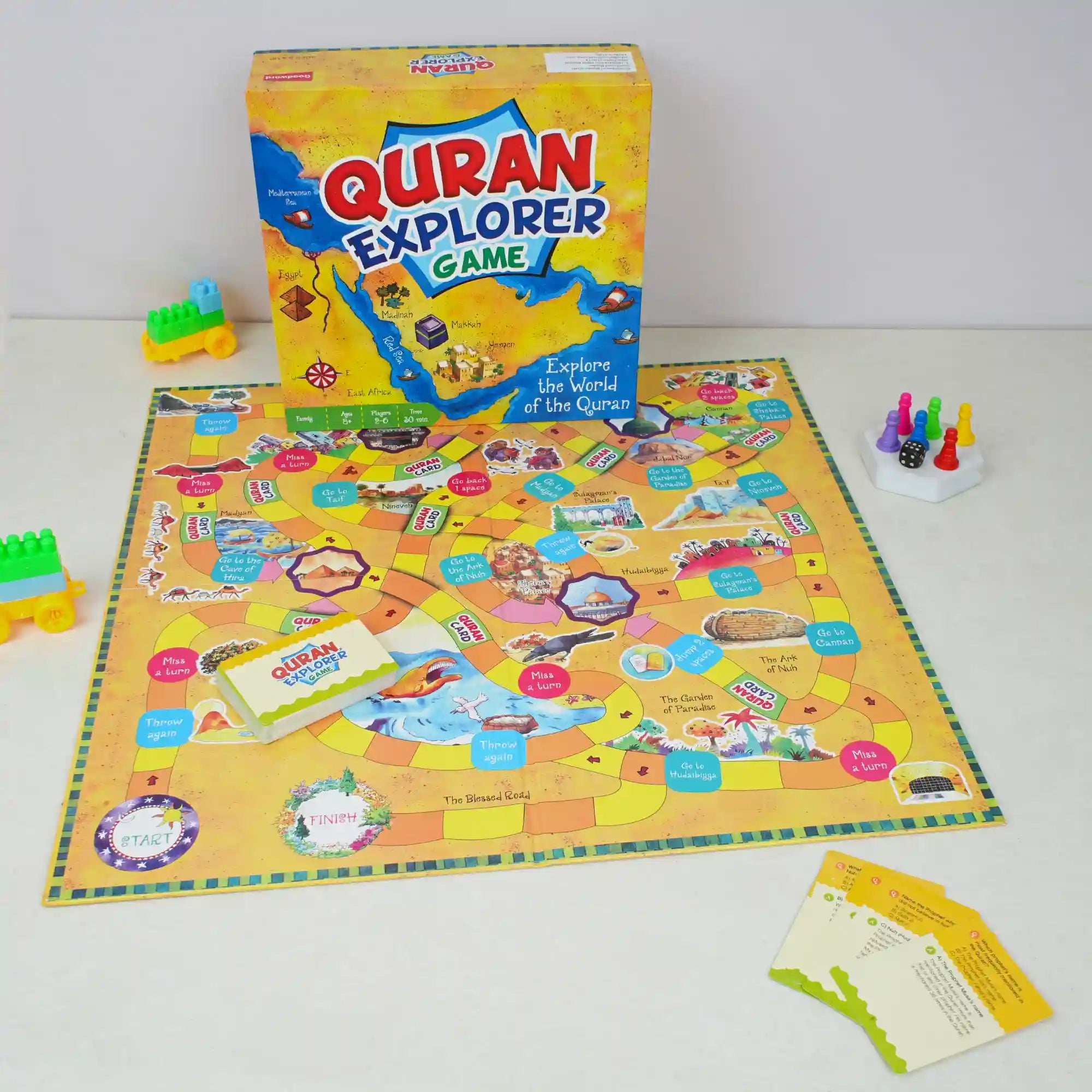 Quran Explorer Game set with board, box, and pieces on a white background