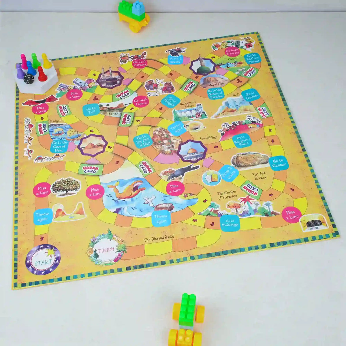 Colorful children's board game on a white surface