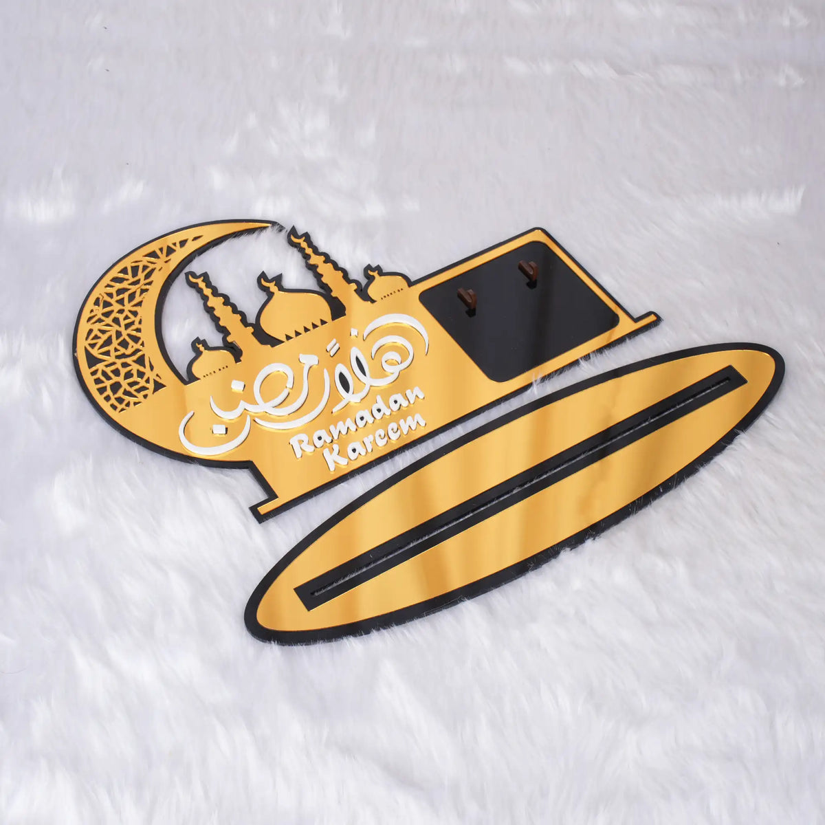 Close-up of Ramadan Kareem calendar decor with black and gold stand