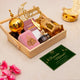 Decorative set with gold lanterns, pink box, and 'Ramadan Mubarak' sign on a light background.