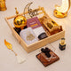 Decorative items for Ramadan with a wooden tray, gold lanterns, and Quranic text