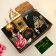Ramadan Kareem Hamper Gifts with greeting card, Quran, golden lantern, bakhoor burner, and sweets for a peaceful Ramadan experience.