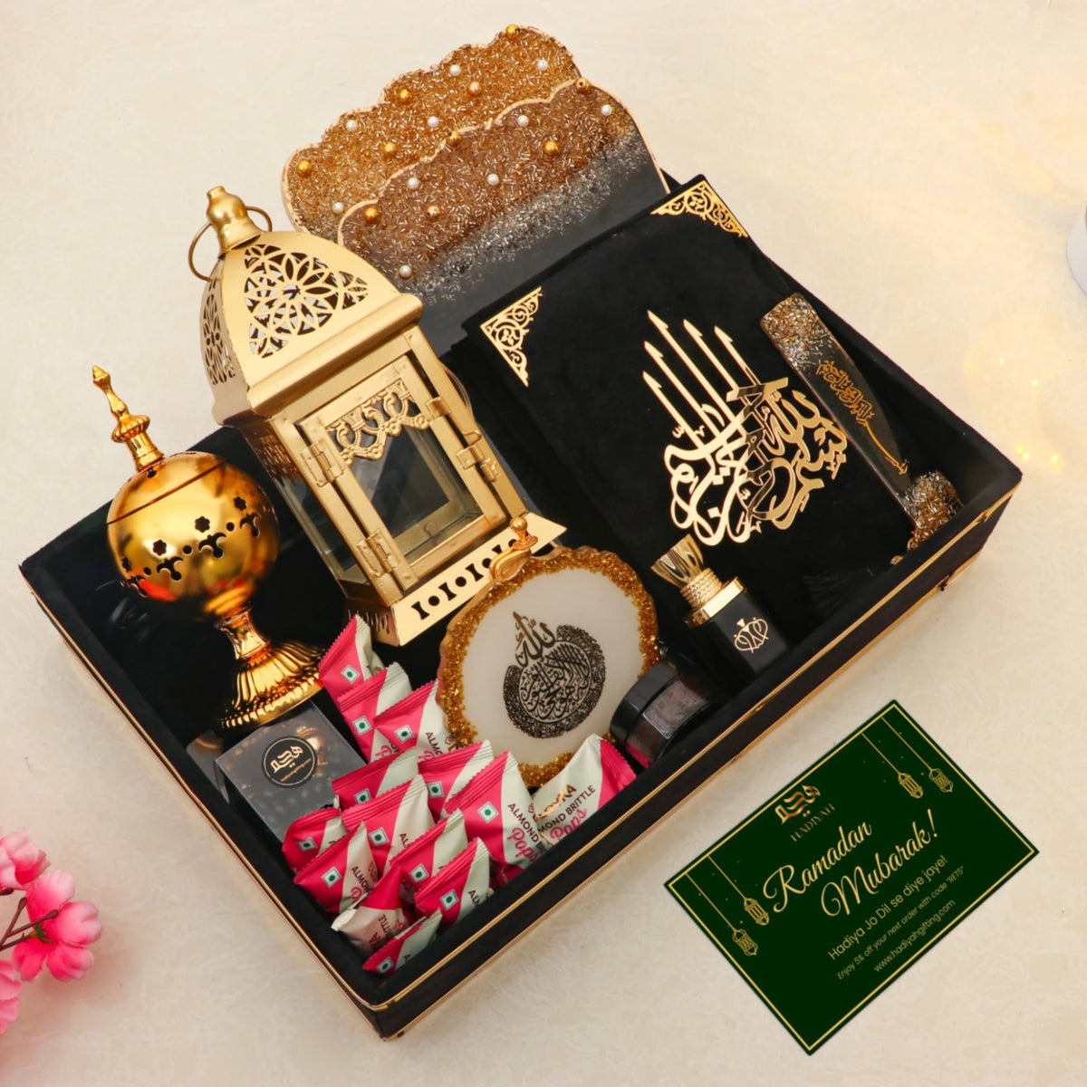 Complete Ramadan Kareem Hamper Gifts set with greeting card, Quran, ittar, bakhoor burner, and sweets, perfect for Eid gifting.