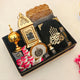 Luxury Ramadan Kareem Hamper Gifts including Quran, golden bakhoor burner, prayer beads, ittar, and assorted sweets in a decorative tray.